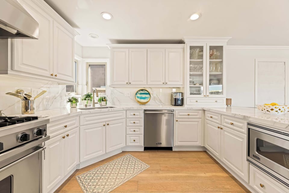 Light filled kitchen with ample cabinets and counter space.