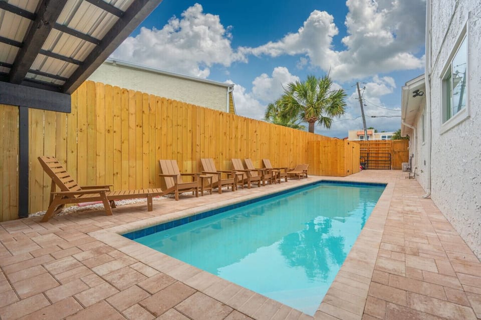 Enjoy a refreshing swim or unwind poolside with comfortable lounge seating.
