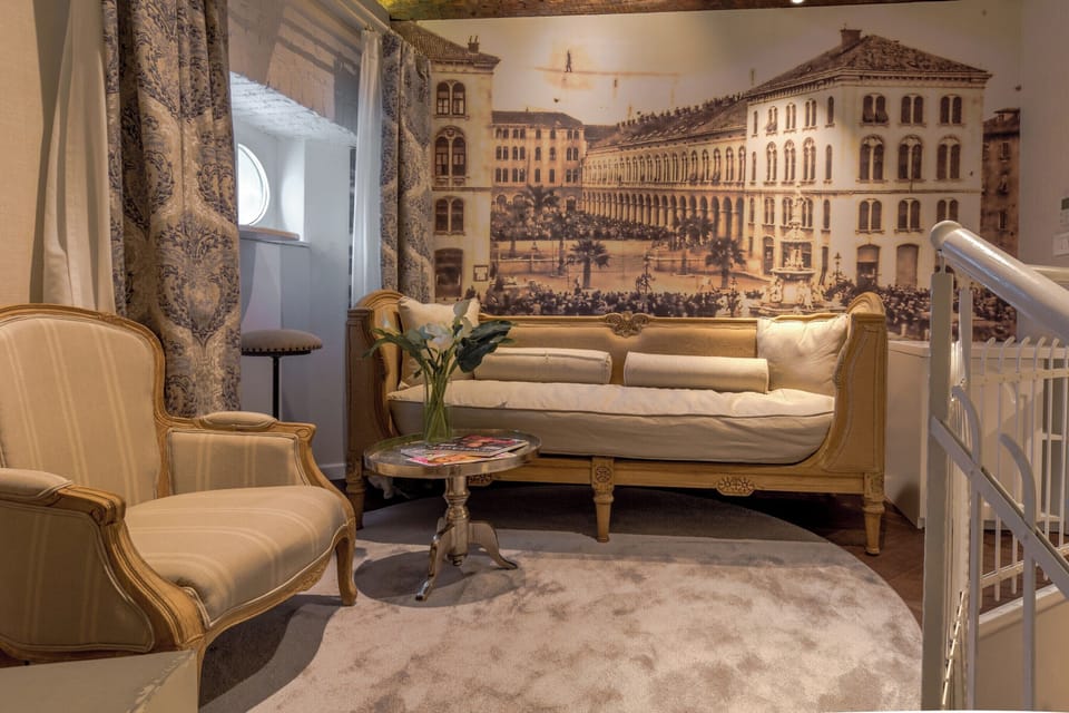 Elegant raised lounge area with vintage-style seating.