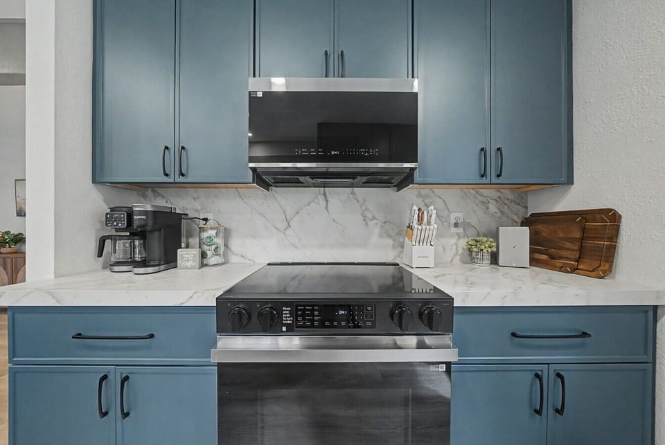 New cabinetry with clean, modern lines sets the tone for the entire space.