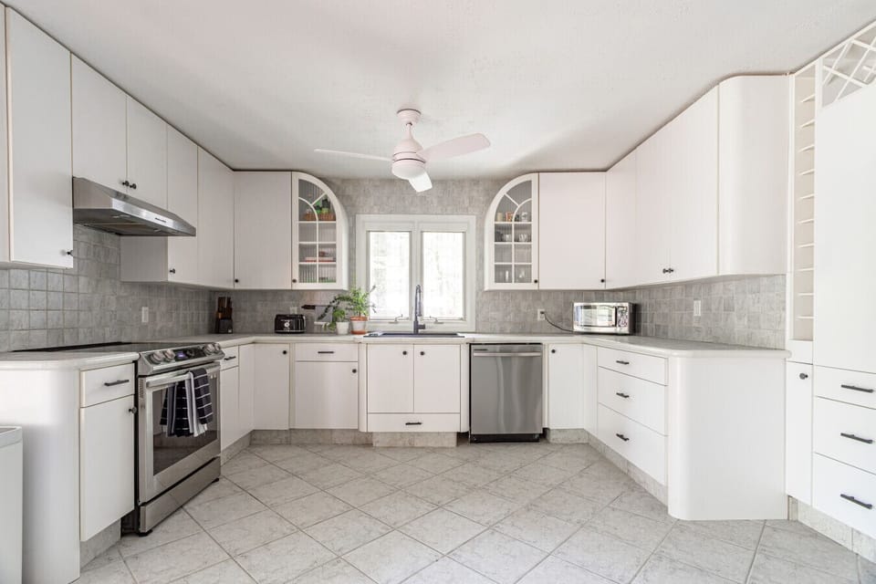 Sleek, modern kitchen with clean lines and updated appliances, perfect for cooking and hosting