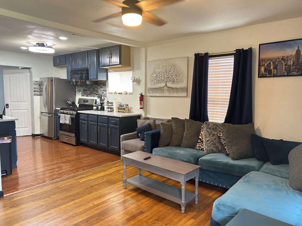 Cozy open living space with large sectional and modern kitchen