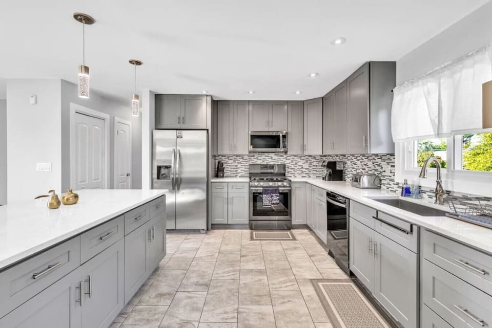 Fully Equipped Modern KitchenBright kitchen featuring stainless steel appliances, ample counter space, modern cabinetry, and everything needed for home-cooked meals.