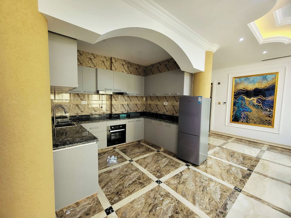 Deluxe Double Room, Balcony, Courtyard View | Private kitchen | Full-size fridge, stovetop