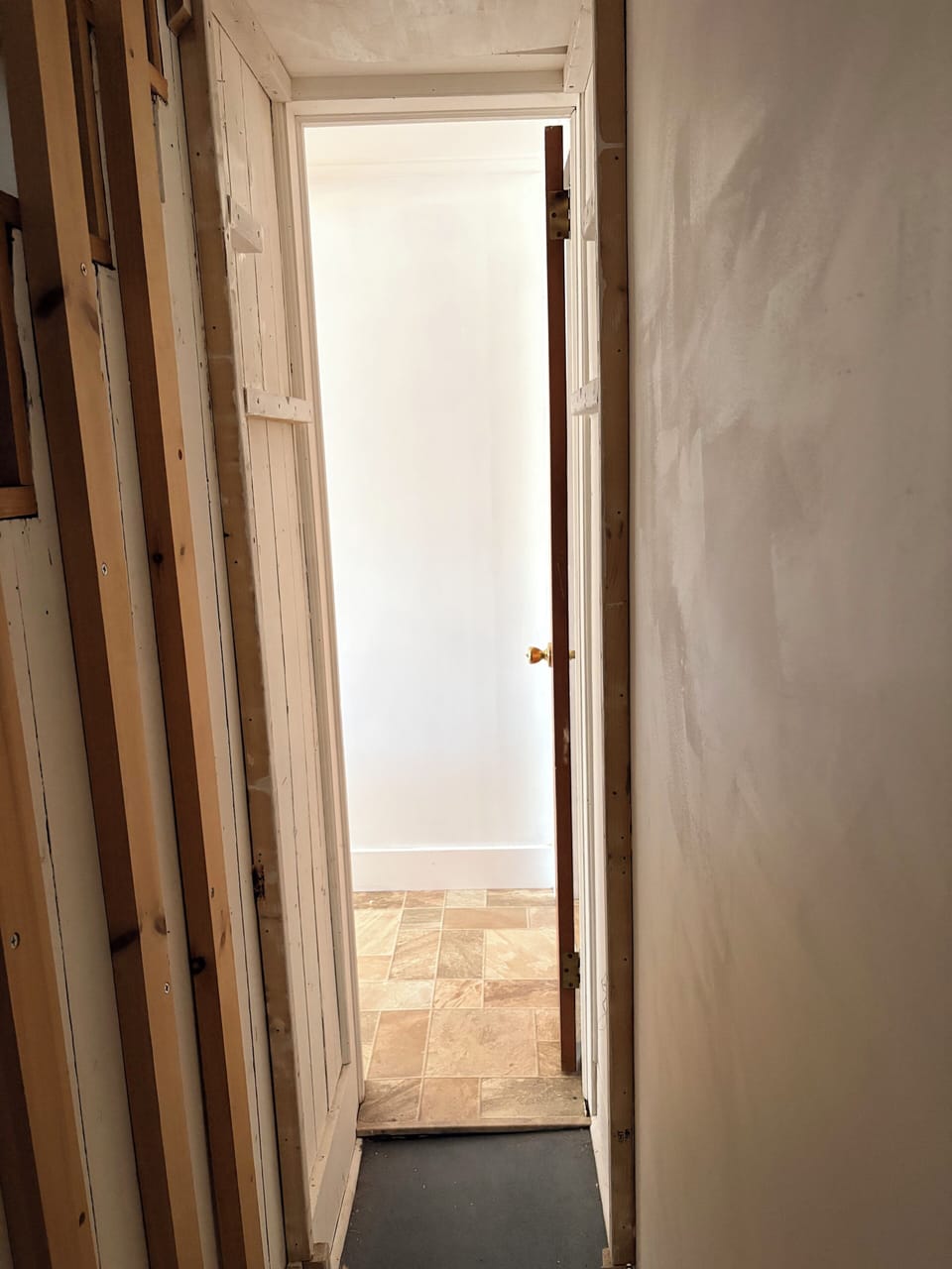 Secret door that leads to stairwell of upstairs unit 