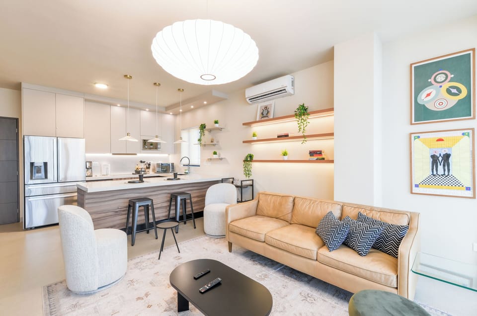 Deluxe Suite, City View | Living area | 44-inch Smart TV with digital channels, streaming services