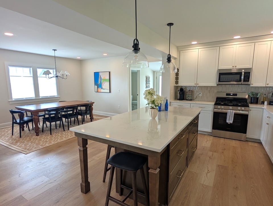 Open kitchen with large island and spacious dining area
