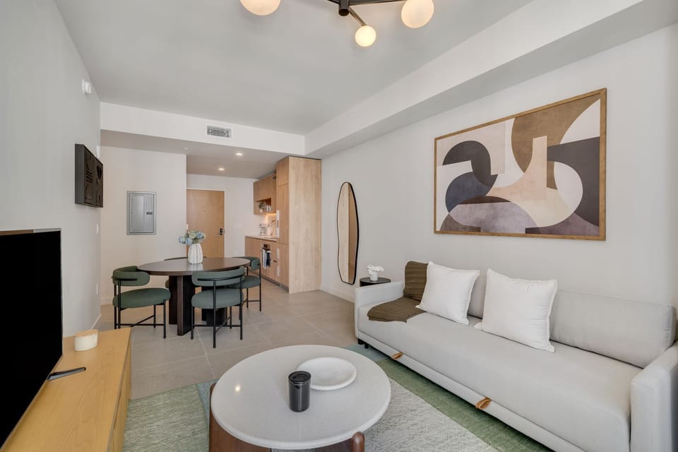 Open living and dining area with clean, modern decor.