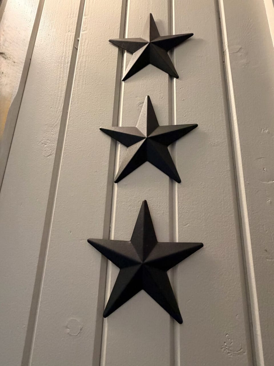Iron stars on shiplap — small details that nod to the stargazer theme