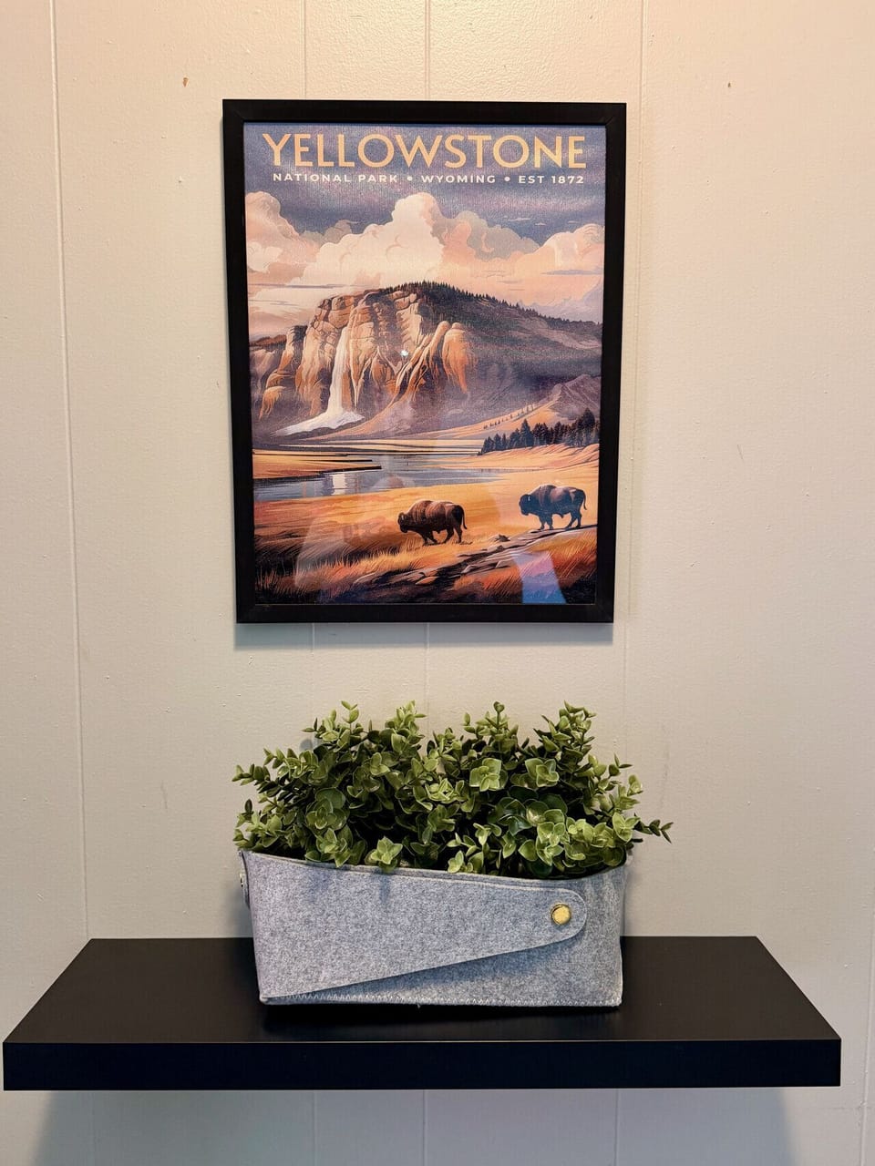 The Naturalist`s Cabin — a living plant anchors the room beneath a desert-landscape canvas