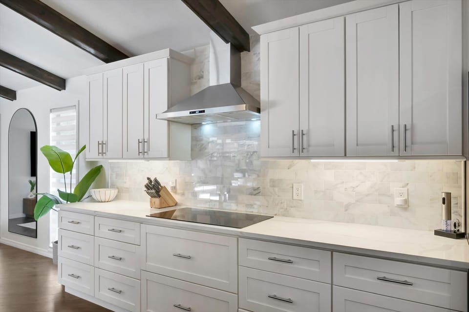 Modern kitchen with white cabinets and storage