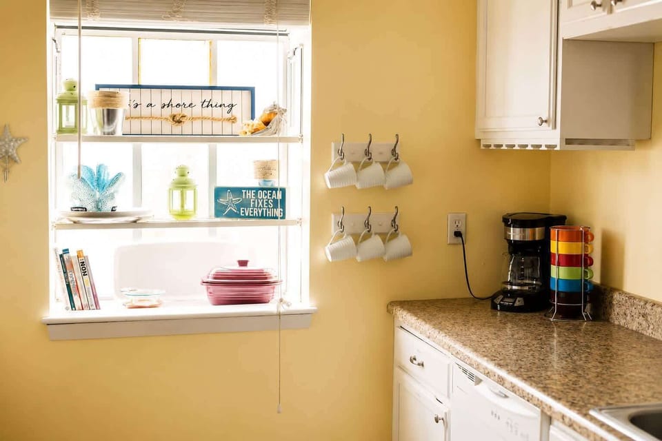 Cozy kitchen corner with warm tones, granite countertops, and charming decorative accents.
