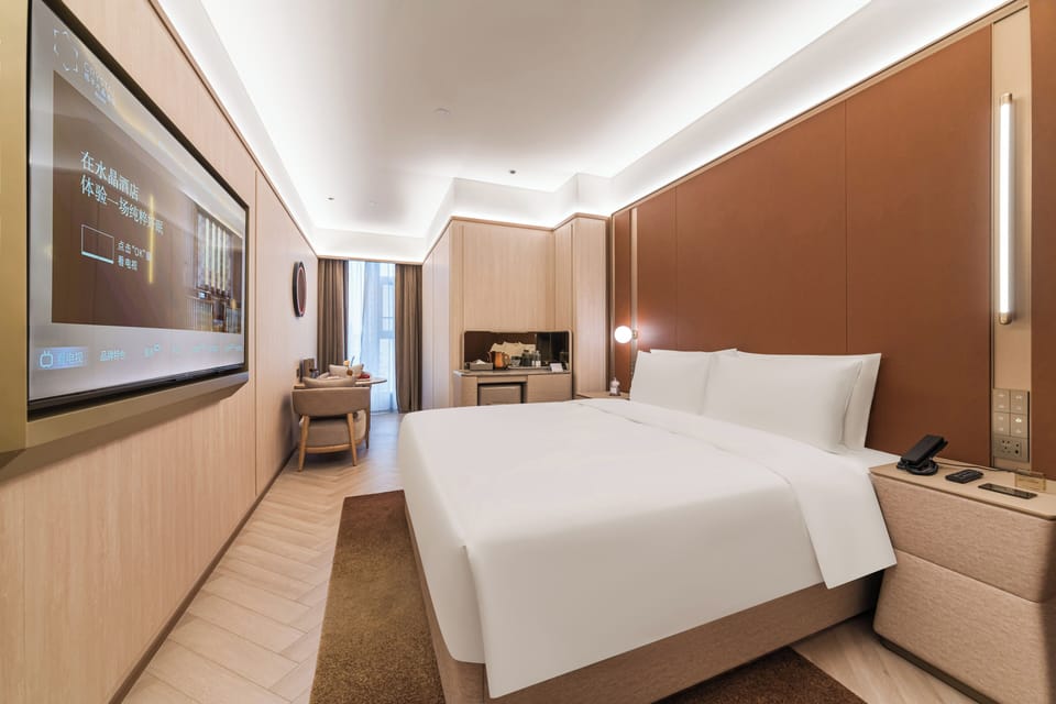 Premium bedding, down comforters, pillowtop beds, free minibar