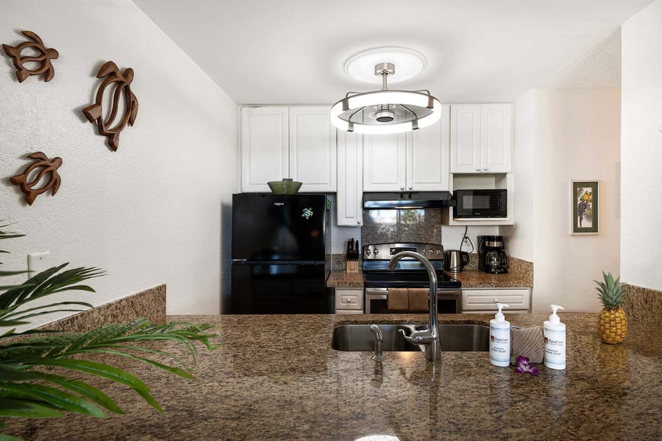 Fully equipped kitchen includes appliances, a dishwasher, and everything needed for easy meals at home
