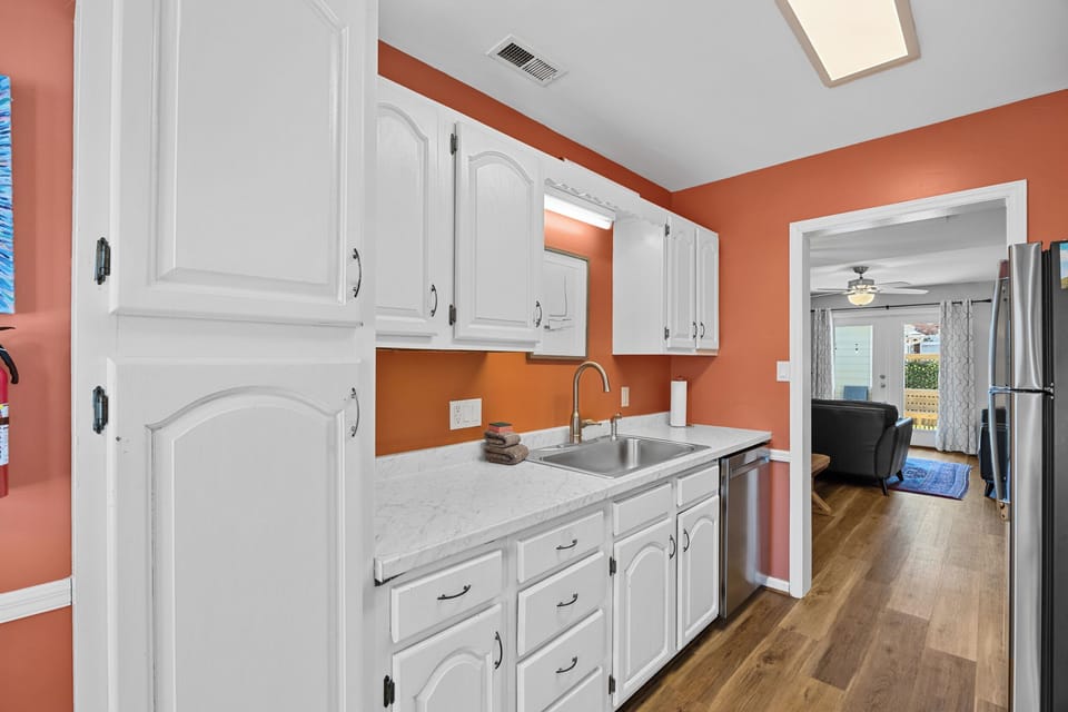 Fully equipped galley-style kitchen stocked with cookware, coffee essentials, and everything needed to prepare meals during your stay.