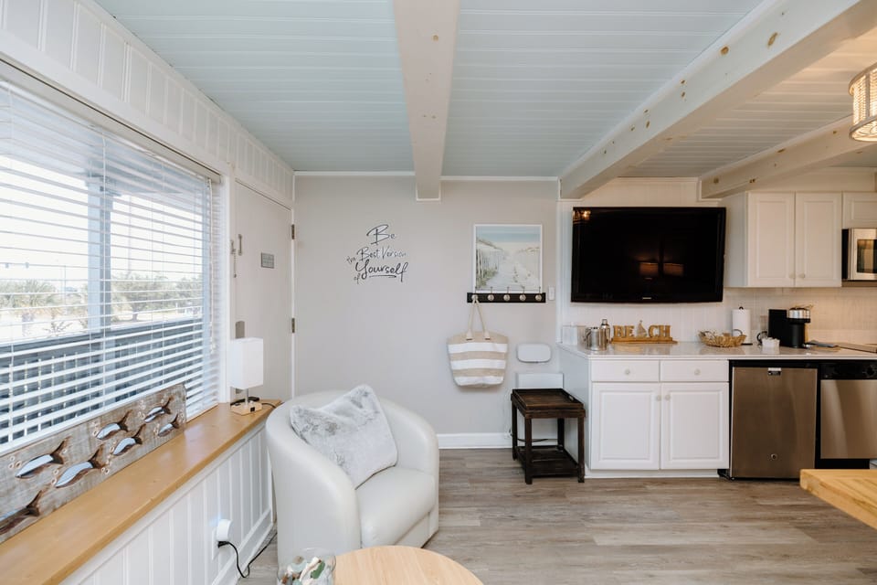 Natural light and coastal-inspired décor create a welcoming atmosphere perfect for relaxing during your Wilmington stay.