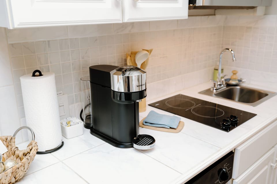 Start your mornings with premium coffee from the Nespresso machine while planning your beach adventures.