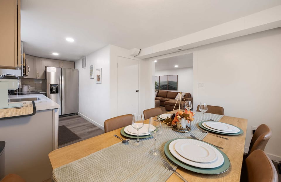 Dining area set for a comfortable meal, just steps from the fully equipped kitchen.