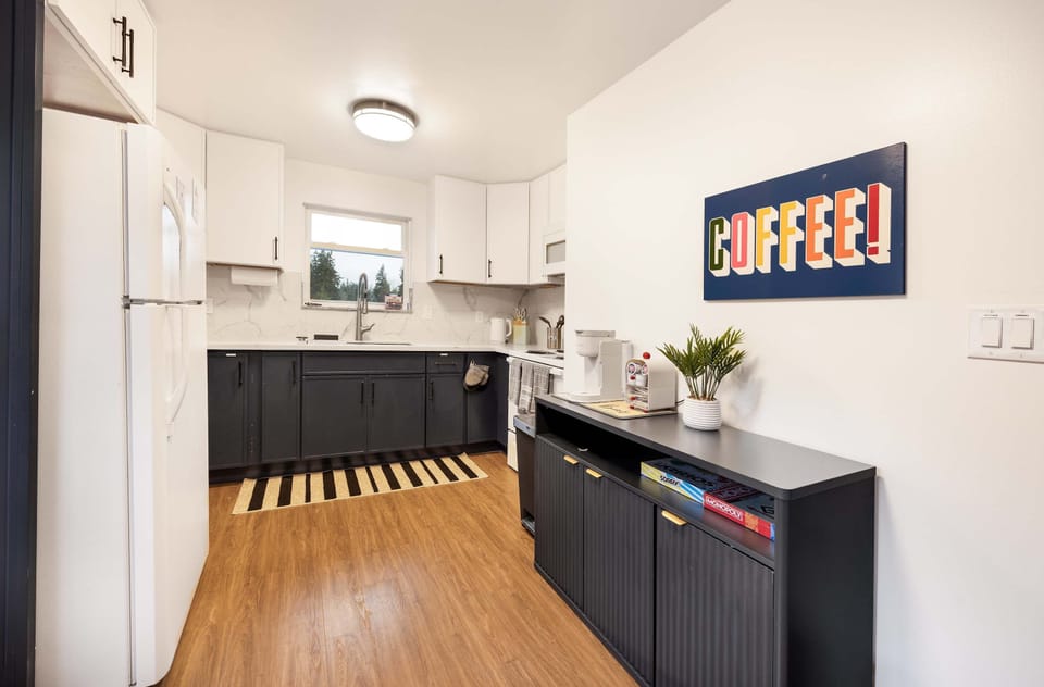 Functional kitchen with ample storage and a dedicated coffee corner to start your day right.