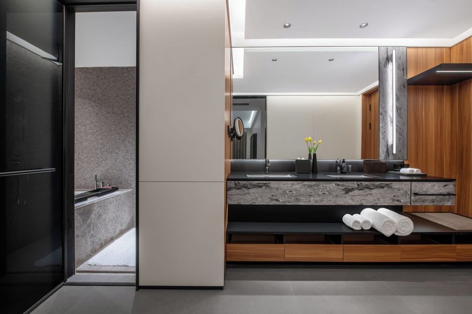 Family Suite, River View | Bathroom | Shower, hair dryer, slippers, towels