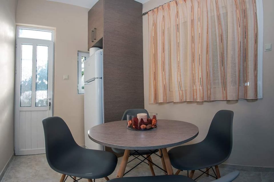 The indoor dining corner offers a quiet, comfortable space for meals and slower evenings indoors.
