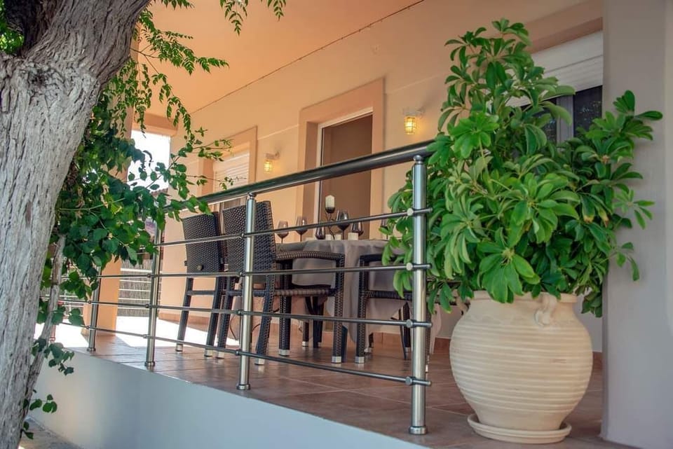 Outdoor seating beside the entrance terrace makes it easy to settle into slow mornings, coffee breaks, and relaxed evenings after the beach.