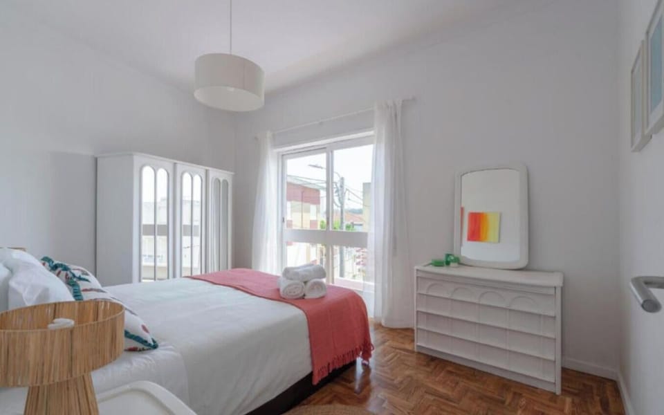 Airy double bedroom with natural light and ample storage