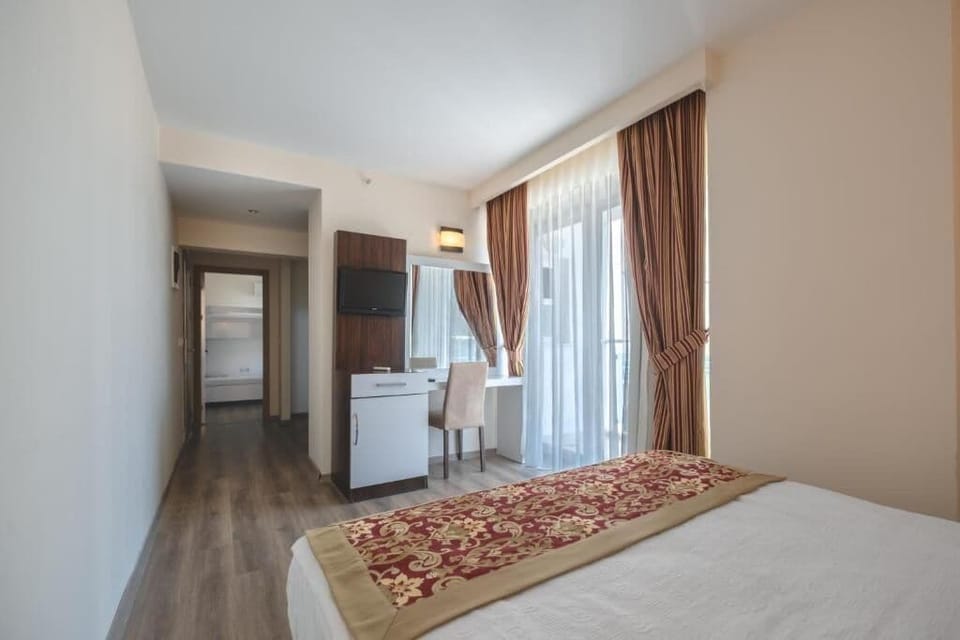 Family Room, Balcony, Partial Sea View | In-room safe, free WiFi, bed sheets, wheelchair access