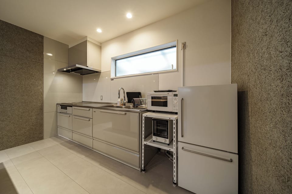 Superior Villa | Private kitchen | Full-size fridge, microwave, stovetop, electric kettle