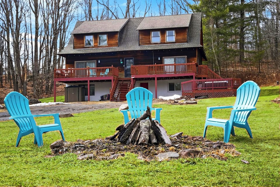 Gather around the fire pit and take in the peaceful setting from this spacious Hudson Valley retreat.
