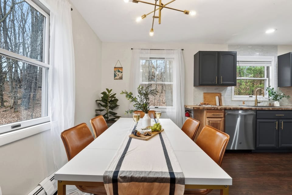 Bright dining space with modern seating and a warm, inviting setup. (The Hollow)
