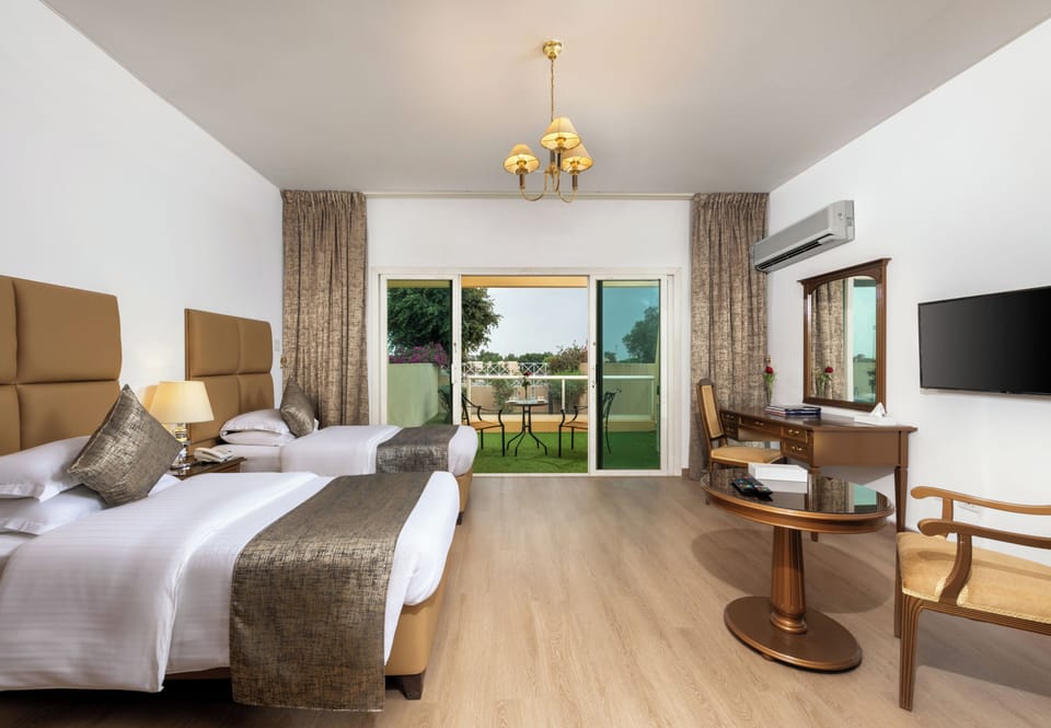 Twin Room, Balcony, Garden View | Desk, laptop workspace, WiFi (free), bed sheets