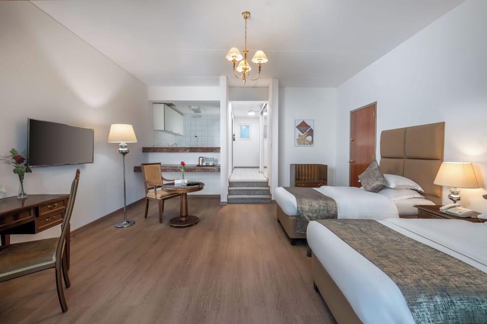 Twin Room, Balcony, Garden View | Desk, laptop workspace, WiFi (free), bed sheets