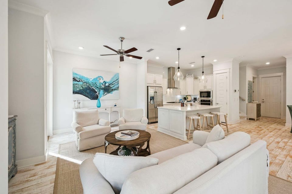 The living room provides plenty of seating for the whole family to sit and enjoy time together.