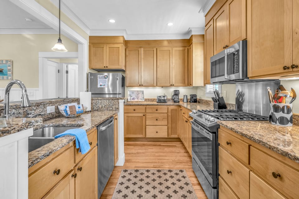 Your fully-equipped kitchen features granite countertops, stainless steel appliances, and everything you need to create memorable meals during your stay.
