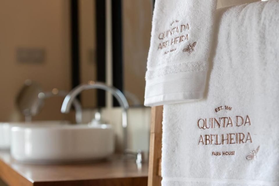 Deluxe Suite, Balcony, Pool View | Bathroom | Free toiletries, hair dryer, bathrobes, slippers