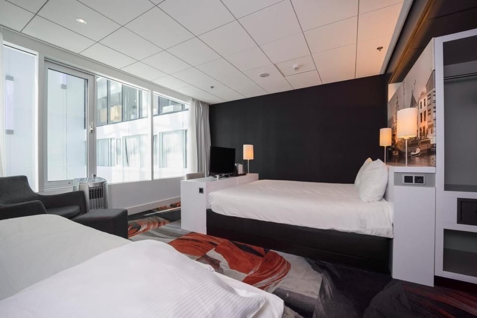 Wake up to natural light beside plush, cloud-soft bedding.
