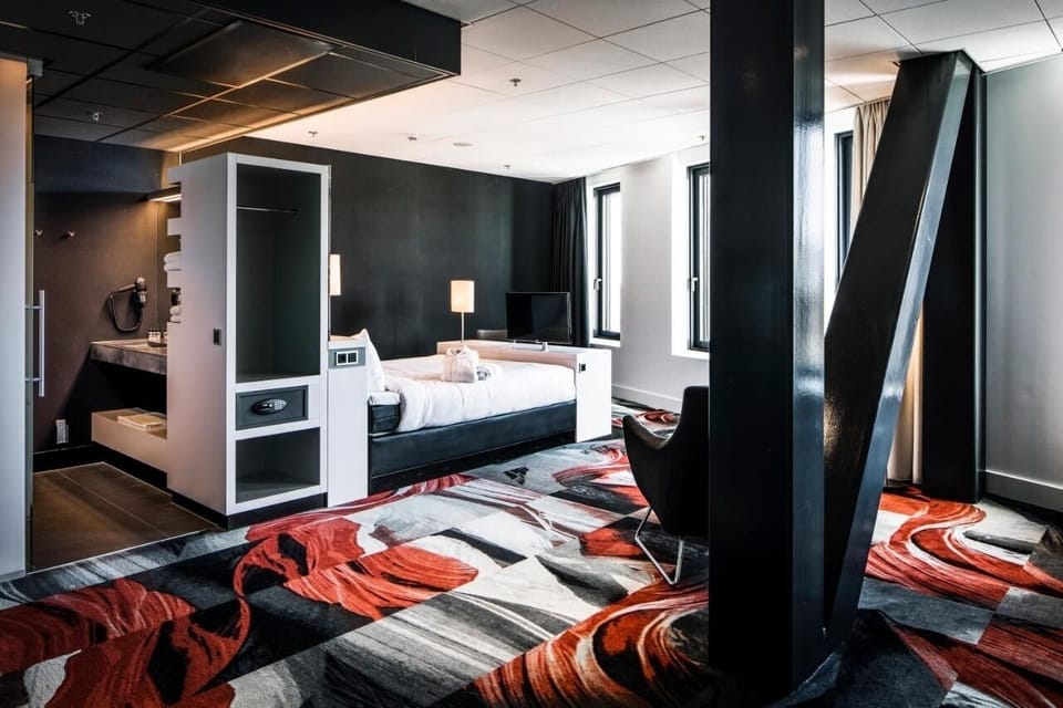 Unwind in a spacious suite with bold design and comfort