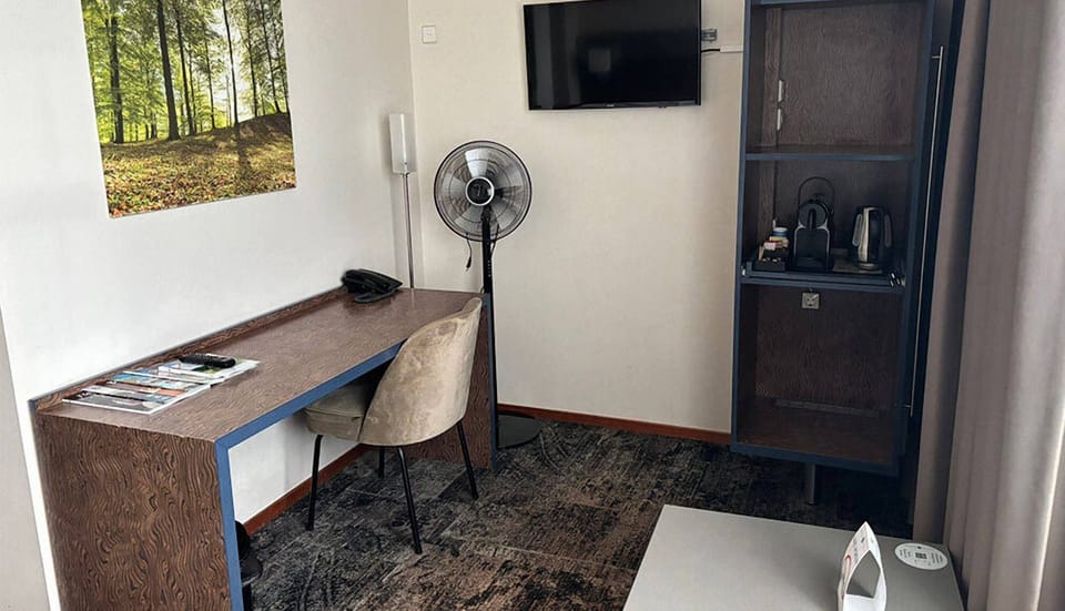 Catch up on emails, then enjoy coffee by the TV.