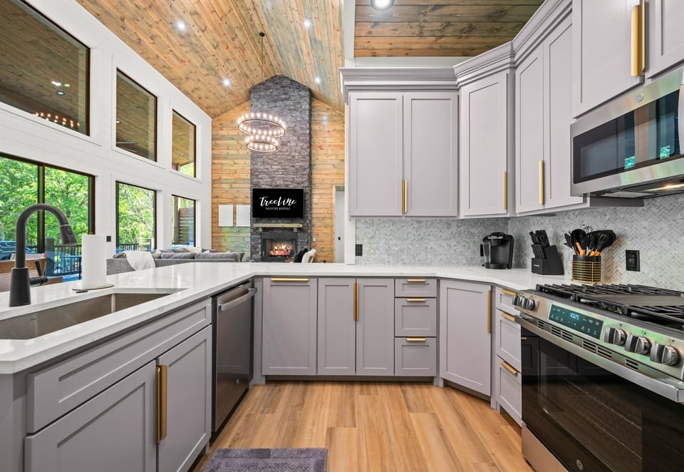 Stainless steel appliances and clean modern design give the kitchen a polished yet comfortable feel.