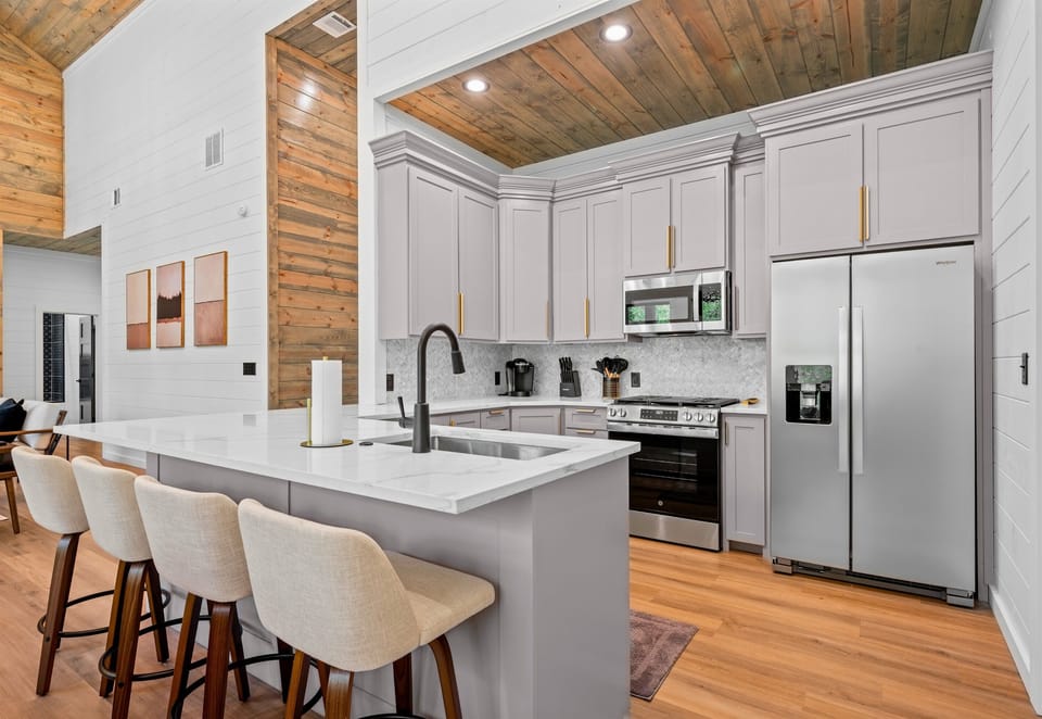 With its oversized island and open layout, the kitchen makes cooking for a group both easy and enjoyable.