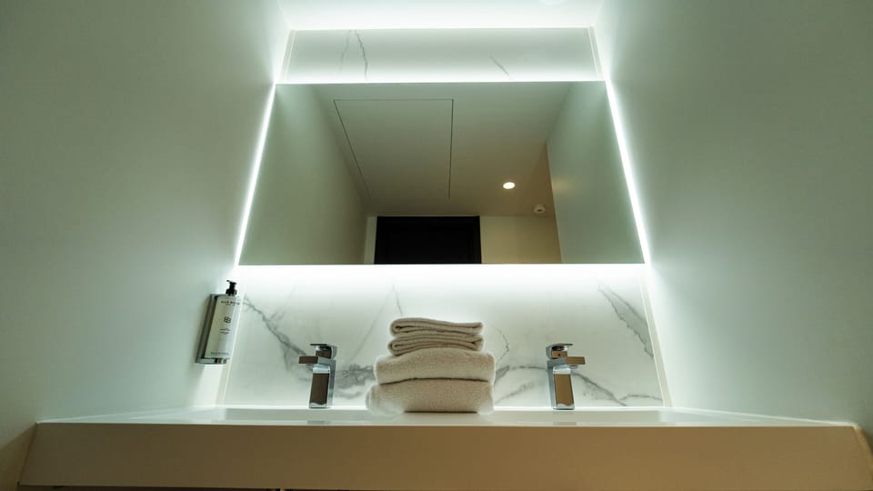 Shower, rainfall showerhead, hair dryer, towels