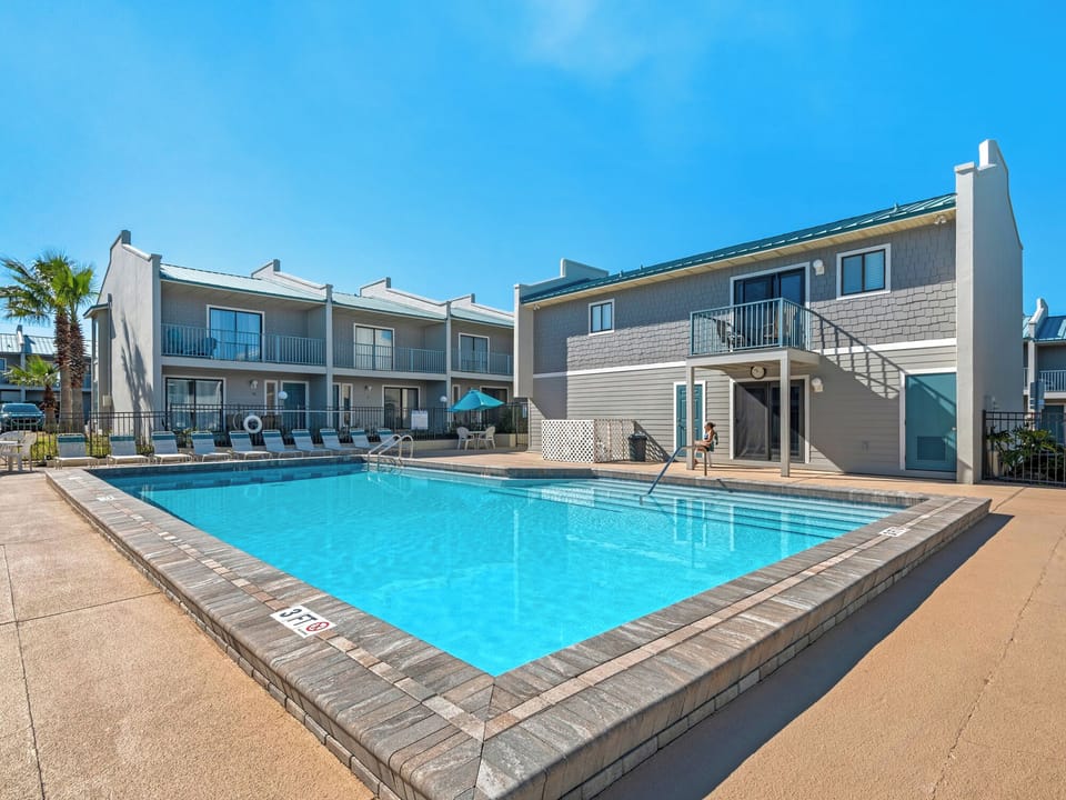 Property courtyard with sparkling swimming pool