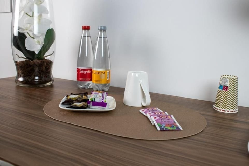 Comfort Quadruple Room, Balcony, Garden View | Food and drink