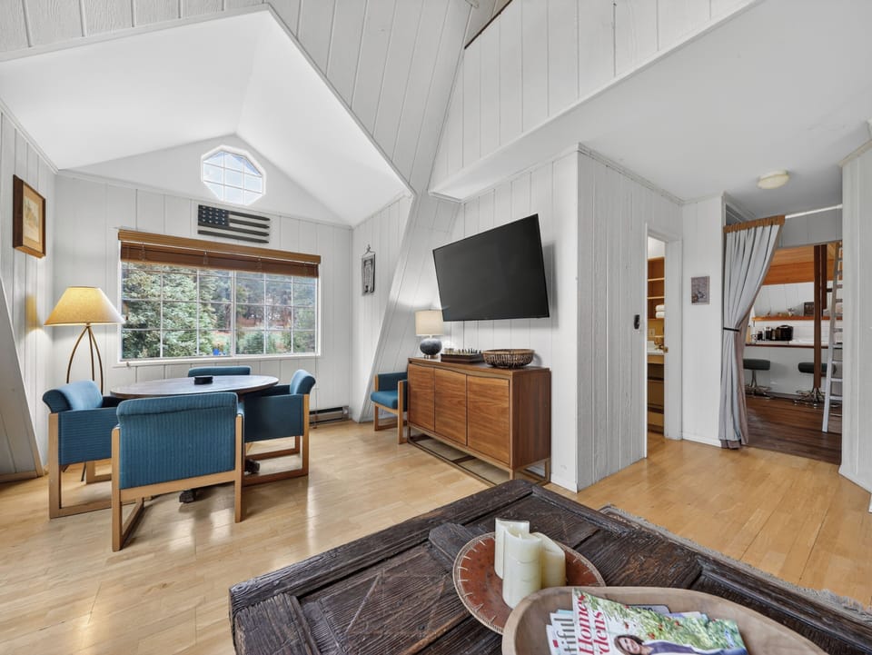Open living space with soaring ceilings and cozy cabin charm