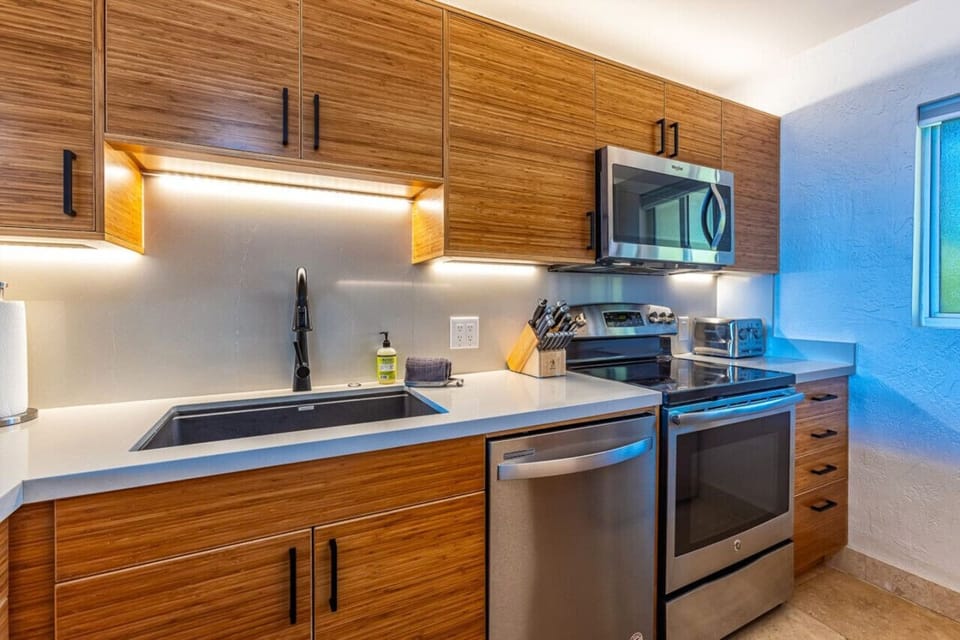 Cook up island flavors in this sleek, modern kitchen—romance is served!