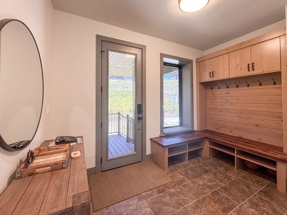 Spacious mudroom with built-in storage benches—perfect for gear, shoes, and easy arrivals.