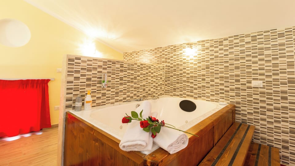 Luxury Suite, Garden View | Bathroom | Hair dryer, bidet, towels, soap