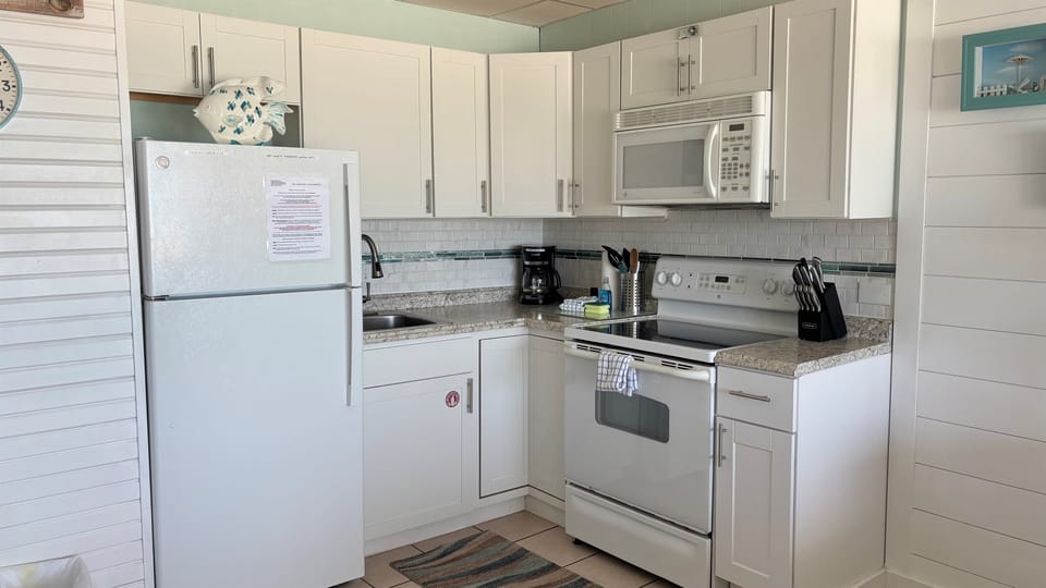Full kitchen with dishes, pots, pans to cook meals if you desire.