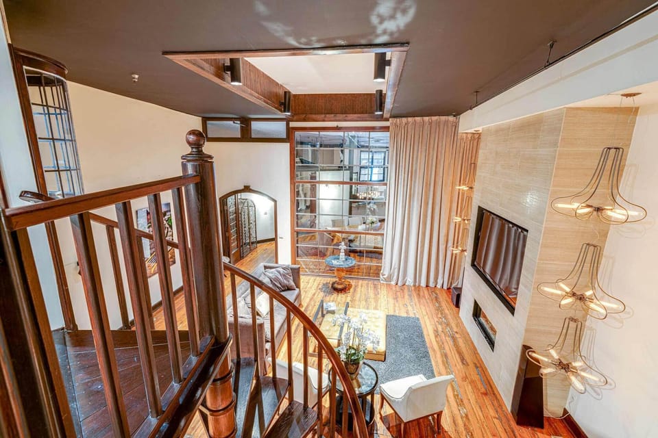 Expansive industrial-chic living area with views.